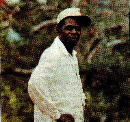 Jamican Harvest Man standing in orchard