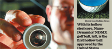 man holding golf ball cut in half to reveal hollow inside